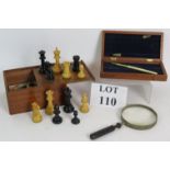 A vintage carved boxwood chess set in mahogany box,