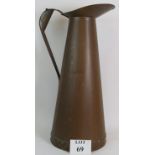 A huge copper jug Circa 1920's with double riveted base. Height: 70cm. Perfect as a stick stand.