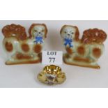 A pair of decorative Staffordshire Pottery style Spaniel dogs and a gilt decorated cabinet cup and