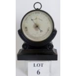 A Belgian brass cased aneroid barometer by Henry Cerf, Brussels in an ebonised tailored stand, C.