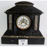 An early 20th Century black slate striking mantel clock with marble panels and engraved decoration.
