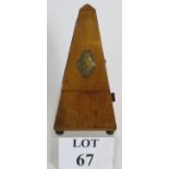 An Early Maëlzel Metronome in a walnut case with lozenge shaped plaque. Height: 22.5cm.