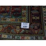 A 20th century Persian rug with central pattern in green, blue, red, brown and cream, 110cm x 160cm.