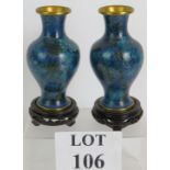 A pair of contemporary Chinese Cloisonné vases decorated in blue and green floral patterns with