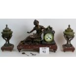 A Late 19th Century French clock garniture of bronzed spelter on red marble titled Les Pigeons by