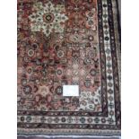 A Hamadan rug on red/brown field, 1.60m x 1.10m. Condition report: Good clean condition.