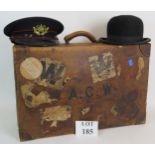 A good quality antique leather suitcase with many travel labels attached, 62cm x 39cm,