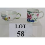 An 18th Century Meissen tea cup with floral decoration and green branch style handle bearing the