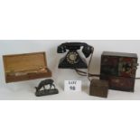 A collection of desk top items including a vintage Bakelite telephone, a bronze figure of a stag,