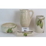 Four pieces of Clarice Cliff moulded leaf design pottery including a jug bowl vase and posy trough.