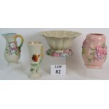 Four pieces of Clarice Cliff hand decorated relief moulded pottery including a large fluted bowl.