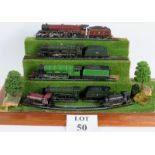 A collection of 15 Hornby 00 Gauge trains in 3 glazed display cases plus original boxes and spare