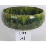 A large Early 20th Century green drip glaze fruit bowl in the style of Bretby/Linthorpe pottery.