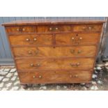 An early 19th century figured mahogany straight front chest,