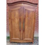 An 18th century French fruitwood armoire,