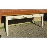 A 19th Century French kitchen/dining farmhouse table with a planked top over a white painted base