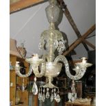 An impressive country house cut glass 5 branch multi tiered chandelier adorned with prism lustre
