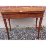 A George III cross banded and boxwood strung tea table,