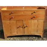 An Arts & Crafts oak & limed oak dresser,