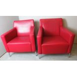 A pair of Enrico Franzolini Italian stitched red leather armchairs,