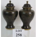 A pair of Chinese Cloisonne covered jars