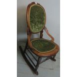 A late 19th century beech rocking chair