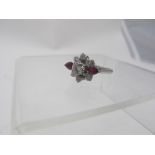 A white metal diamond and ruby cluster r