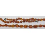 An individually knotted graduated amber