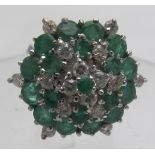 An emerald and diamond hexagonal cluster