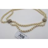 An unusual double strand pearl necklace,