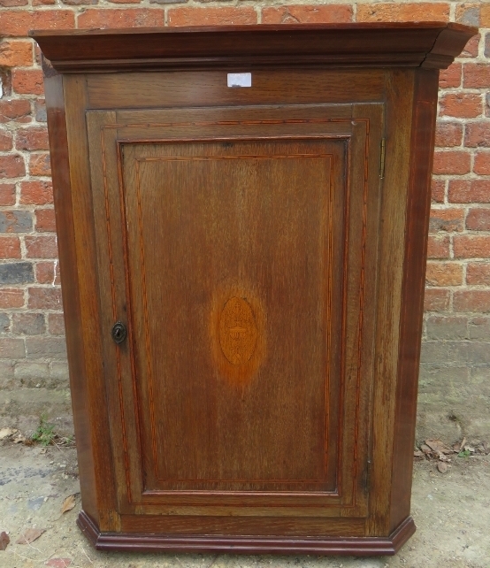 A 19th Century inlaid oak corner cabinet