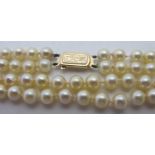 A two strand individually knotted pearl