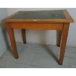 A 19th century oak writing table with a