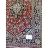 A Persian rug with central pattern on r