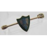 A 9ct gold enamelled shield shaped bar b