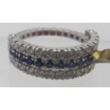 A sapphire, ruby and diamond triple band