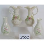 A pair of Belleek jugs with applied flow