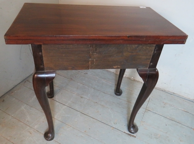 A Georgian mahogany turn over tea table