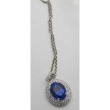 A tanzanite and diamond pendant, designe