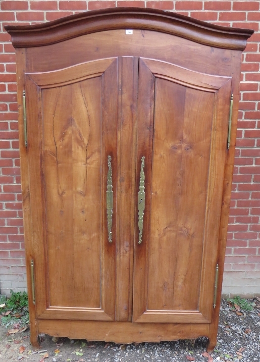 An 18th century French fruitwood armoire