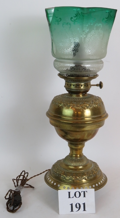 A Late Victorian brass oil lamp and shad