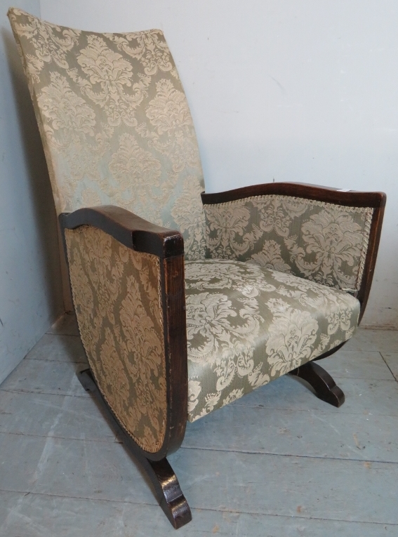 A 20th Century oak framed nursing chair