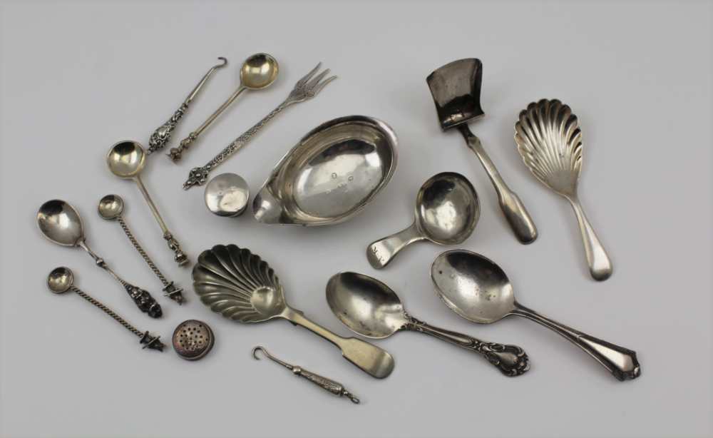 A COLLECTION OF SILVER ITEMS comprising; a George III silver caddy spoon of plain form, other