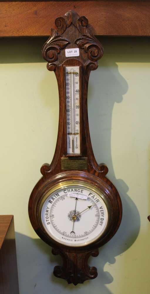 A CARVED OAK BACKED BANJO BAROMETER THERMOMETER with presentation plaque