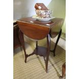 A FOUR FLAP MAHOGANY OCCASIONAL TABLE supported on 'S' shaped legs, united by a fancy shaped