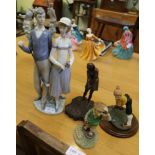 A LARGE LLADRO FIGURE OF A MALE & FEMALE GOLFING COUPLE, together with three other humorous