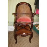 A 19TH CENTURY CHILD'S BERGERE BACKED CHAIR, supported on continental carved cabriole legs, together
