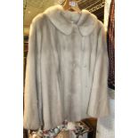 A LADIES LIGHT COLOURED FUR JACKET