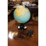 A SELF ILLUMINATING TABLE GLOBE