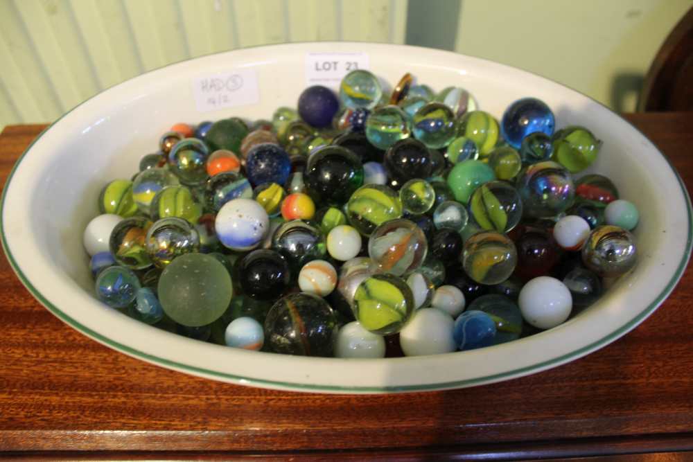 A LARGE SELECTION OF COLLECTABLE GLASS MARBLES housed in a Royal Worcester dish